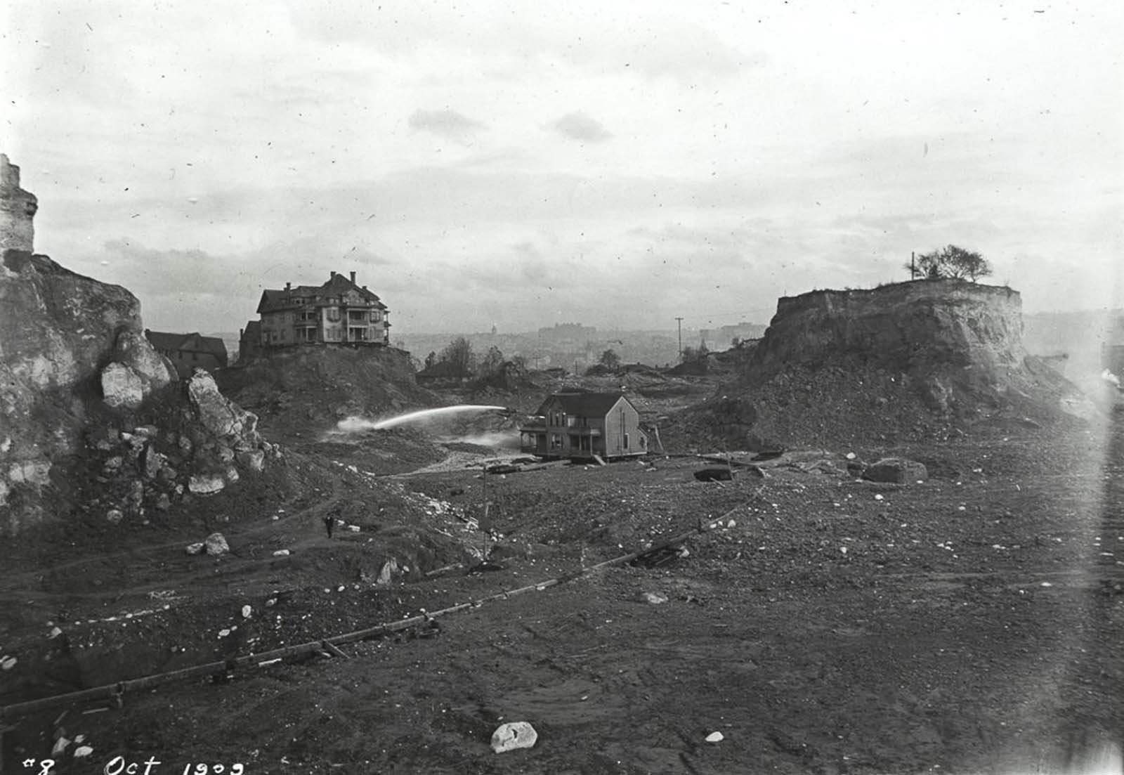 A few “spite mounds” stand amid the flattened remains of Denny Hill. 1909.