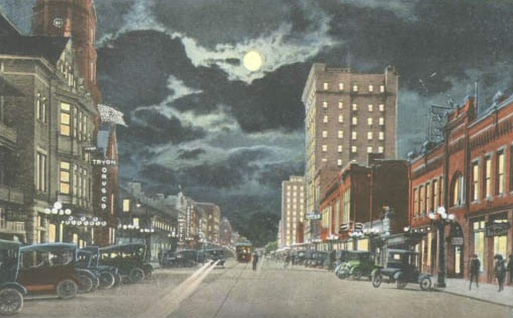 The 100 block of North Tryon Street at night, 1925