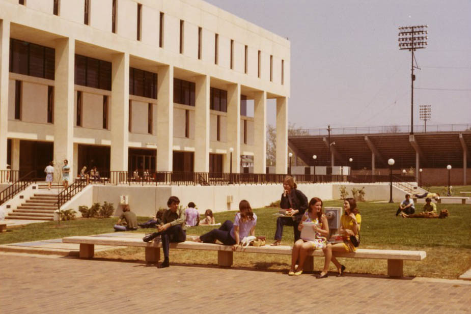 Students hanging out in the quad in front of the Library, 1970s