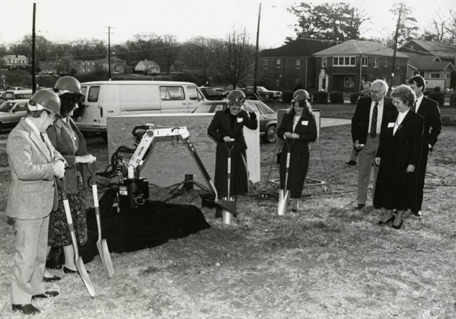 Dr. Ruth G. Shaw, far right, standing with a group of unidentified people, with shovels digging where the Advanced Technology building is going to be, 1970s