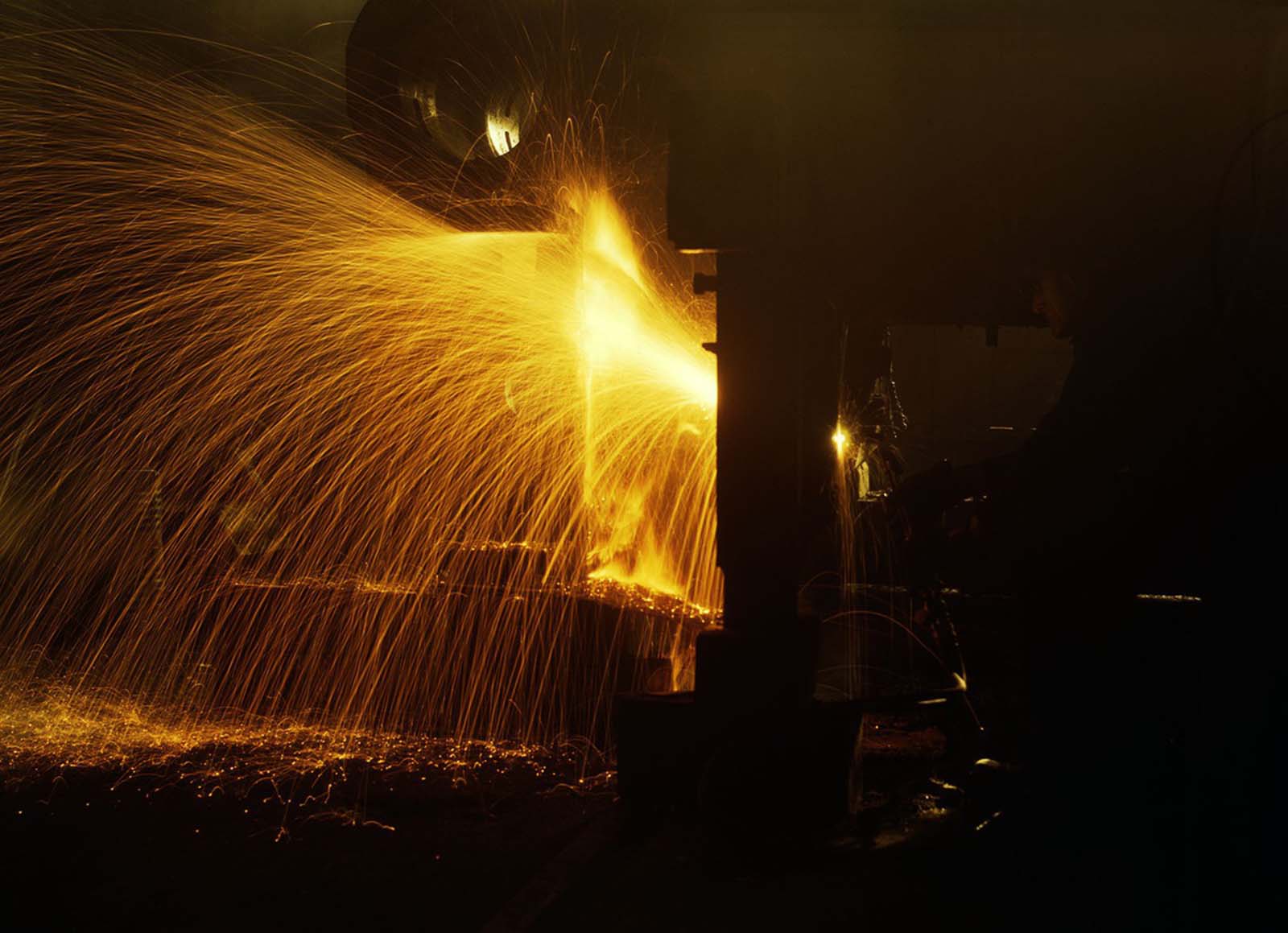 A welder works in the roundhouse of the Chicago and North Western Railroad’s Proviso yard in December 1942.