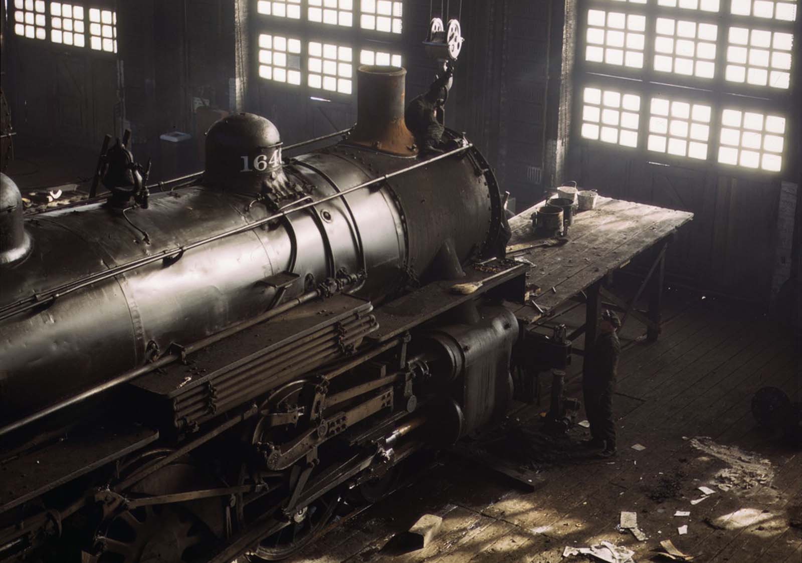 Working on a locomotive at the 40th Street railroad shops in Chicago in December 1942.