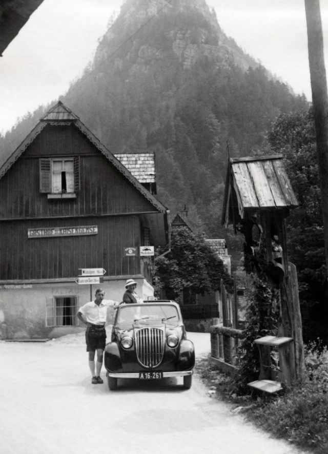 A stylish couple posing with a Steyr 50 in the Styrian village of Palfau, rural Austria.