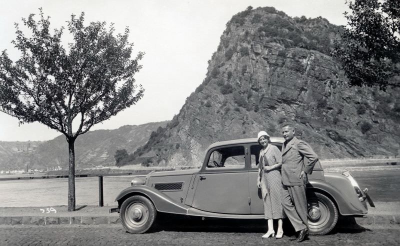 A stylish couple posing with a Wanderer W 240 on a sunny summer's day.