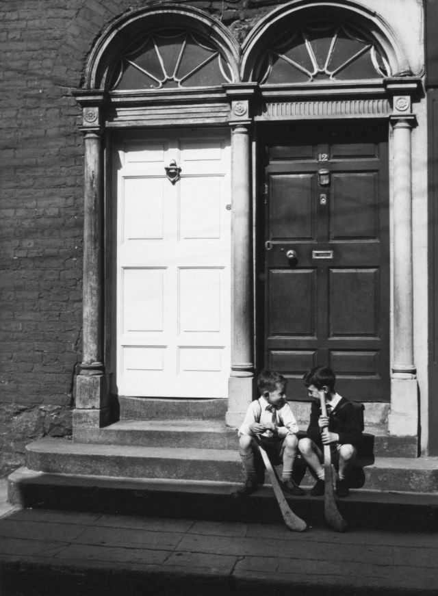 Two boys on a doorstep, Kilkenny, Ireland