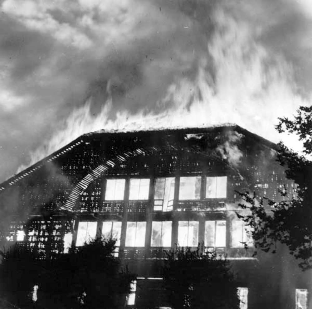 The Forestry Building as it appeared around dusk on the night of the fire, after the flames had died down a little, Portland, 1964.