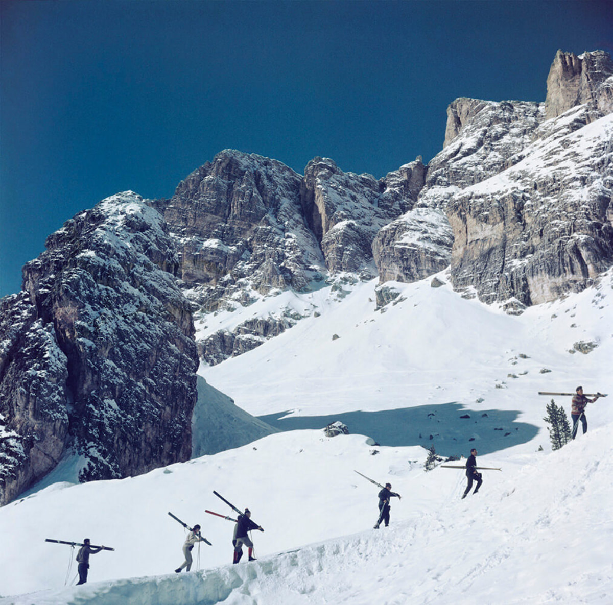 Skiers walk up a mountain in Cortina D’Ampezzo, a ski resort in northern Italy, 1962.
