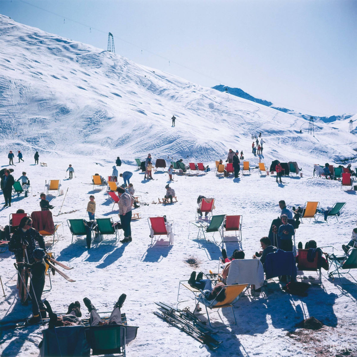 Holiday-makers take the sun on a mountain top in Verbier, 1964.