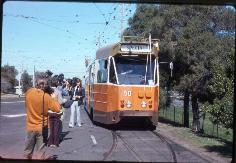 News reporters beside the no.50 tram, Melbourne, circa 1970s