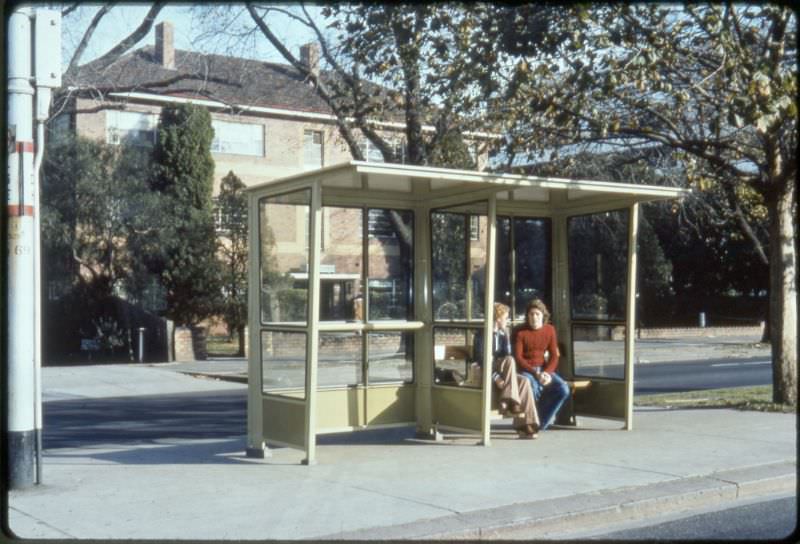 Waiting for public transport to arrive, Melbourne, circa 1970s