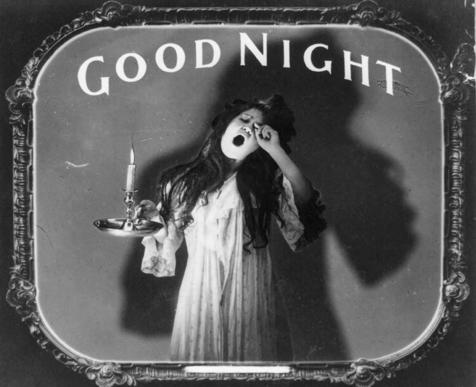 This slider was used at the end of the silent movie and showed a female yawning while holding a candle underneath the message ‘goodnight’