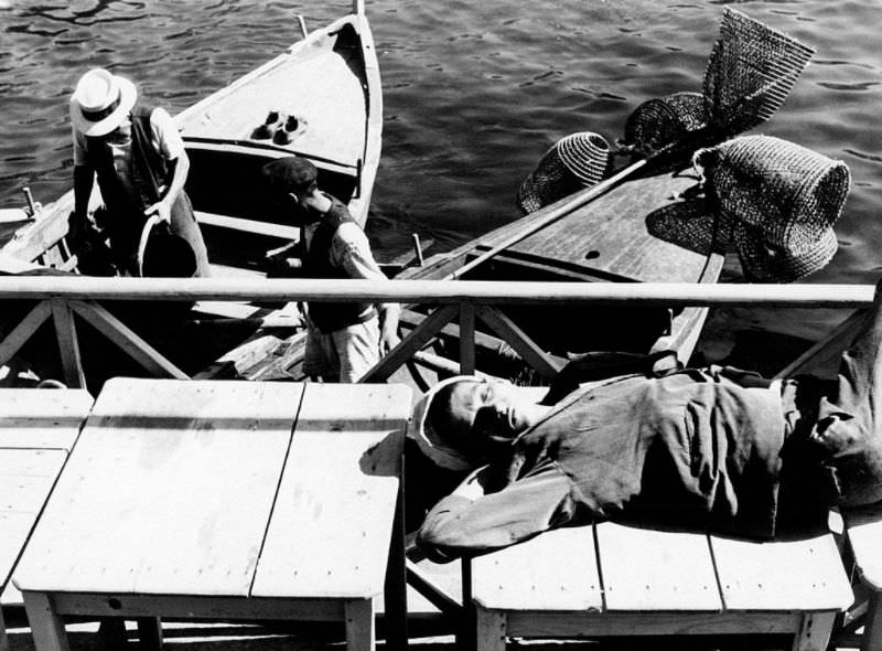 Man resting at a pier.