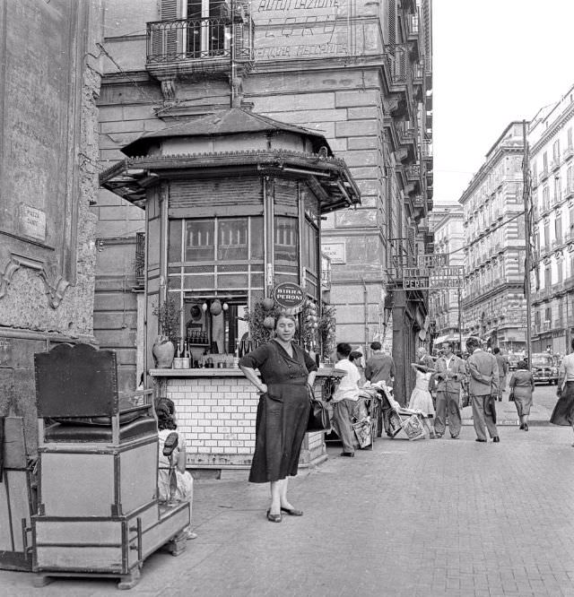 Woman standing at the corner of street