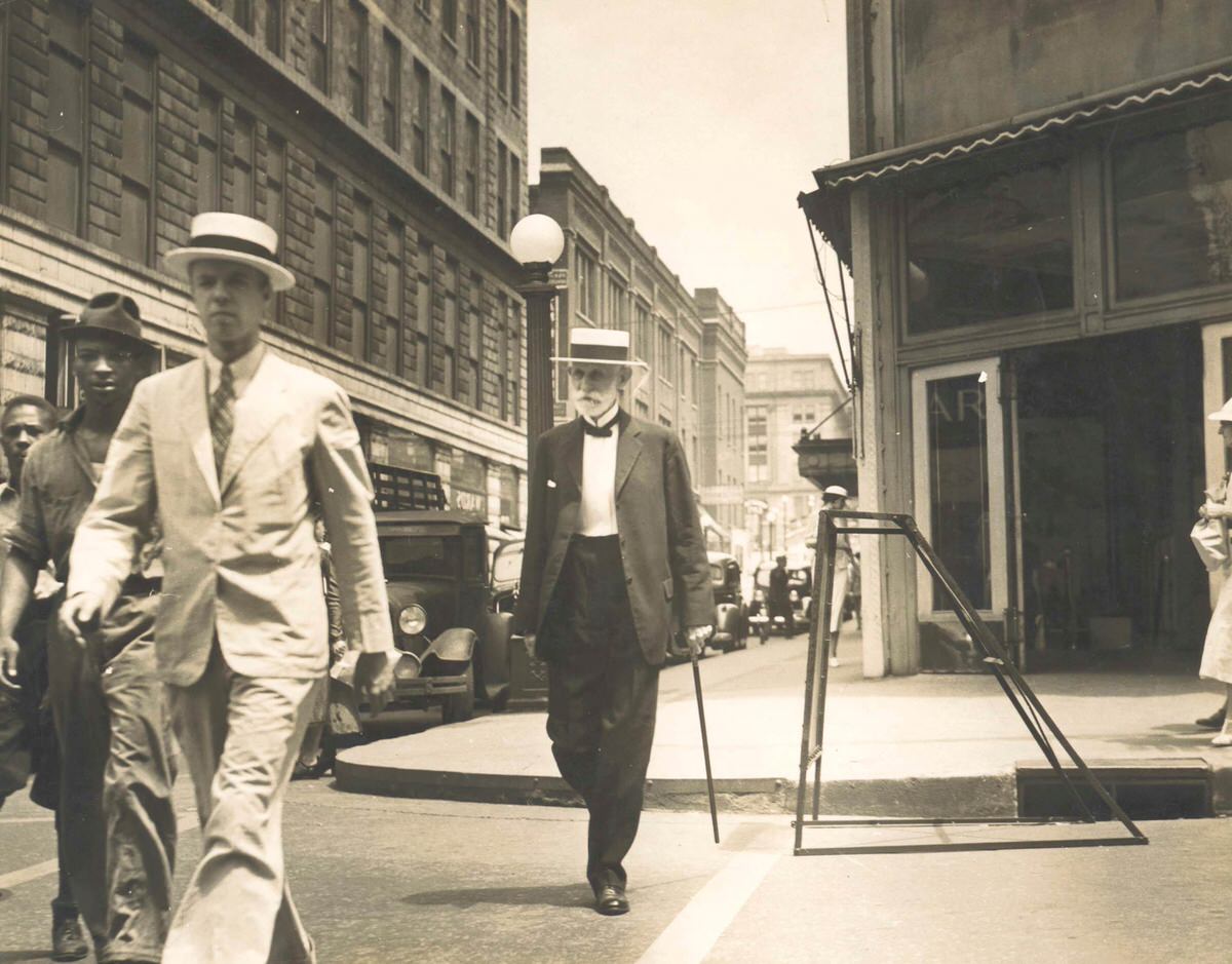 James E. Caldwell walking on 4th Avenue, 1937