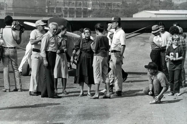 Mayor Fulton and a group of people standing around an airplane that appeared at the 1982 Courthouse Day hosted in Nashville, Tennessee.