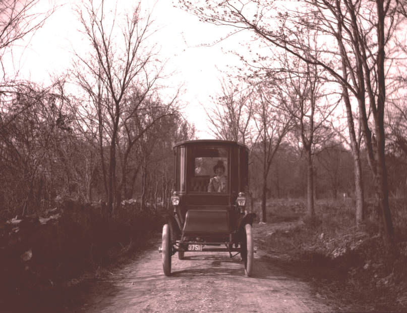 A woman driving an electric automobile, Nashville, 1910s