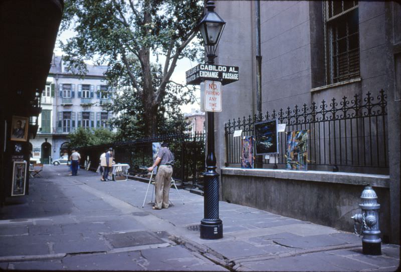 Pirate's Alley with painter, New Orleans, 1956.