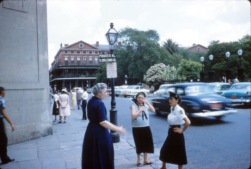 Policewoman and other women at St Louis Cathedral, New Orleans, 1956.