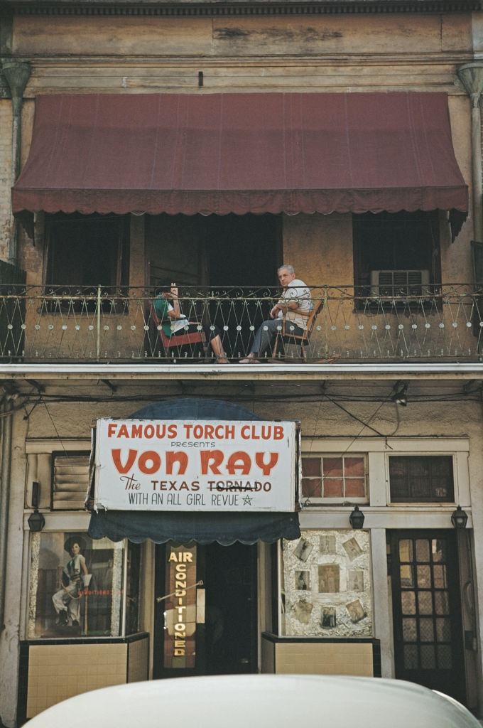 A sign advertising 'Von Ray - The Texas Tornado' outside New Orleans nightclub 'The Torch Club' on Bourbon Street, New Orleans, 1953.
