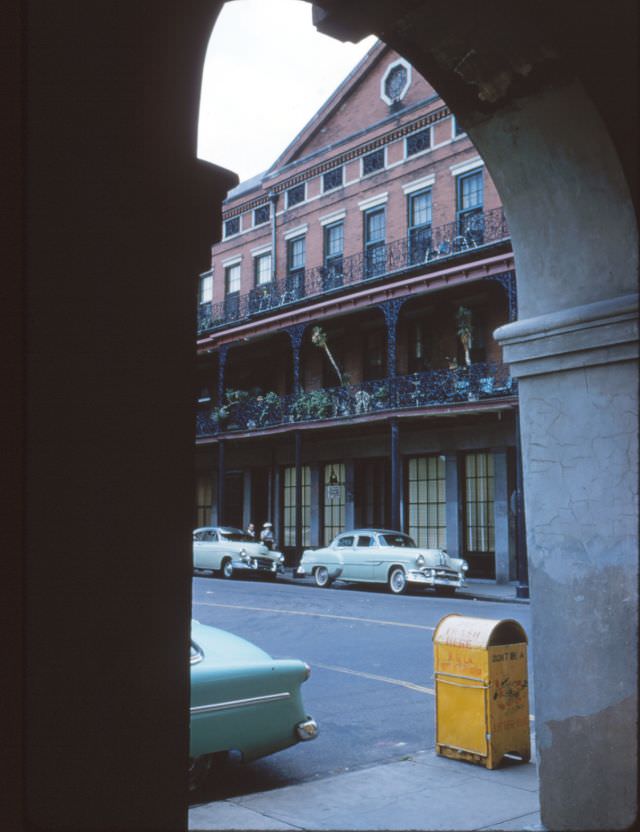 Pontalba Apts, cabildo arch, yellow trash can, New Orleans, 1956.
