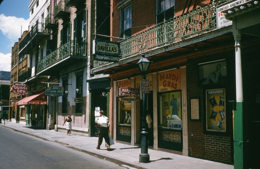 A view down Bourbon street outside Sid Davillas Mardi Gras Lounge in New Orleans, 1957.