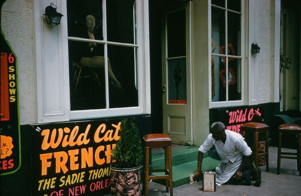 A view down Bourbon street outside the Wild Cat Frenchie bar in New Orleans, 1957.