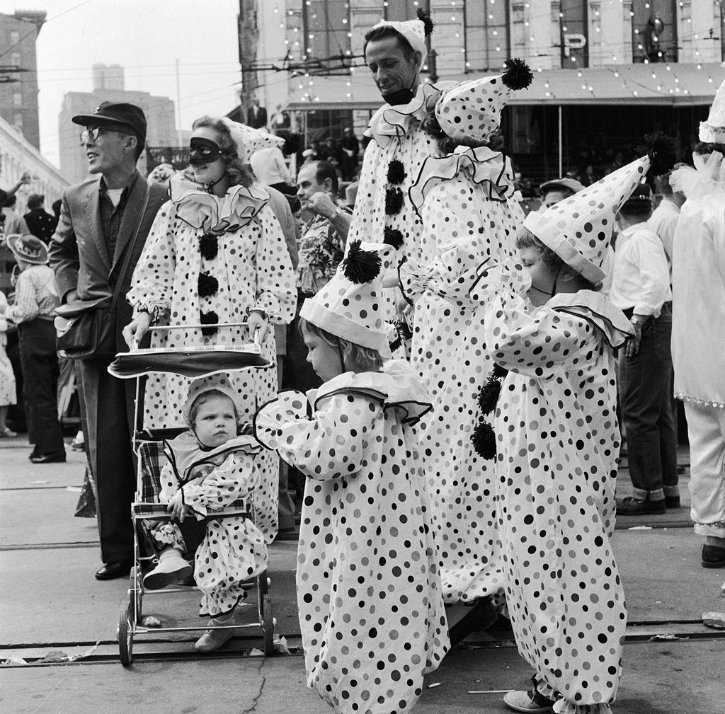 A family in fancy dress dressed identically as clowns at the Mardi Gras, in New Orleans, 1956
