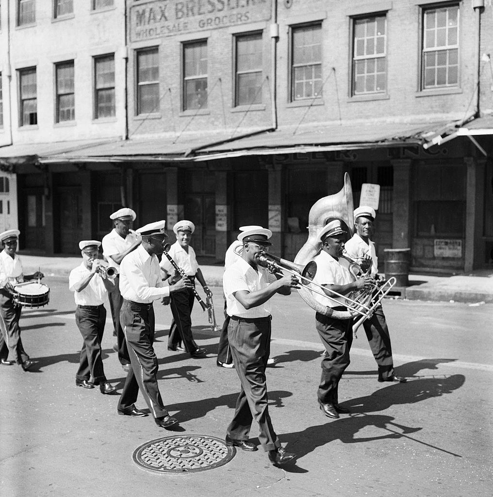 A marching brass band in a New Orleans parade, 1950s