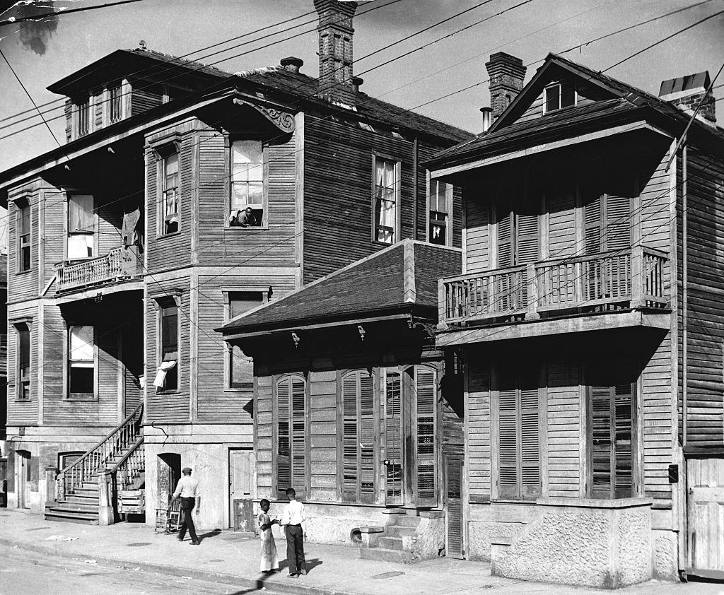 A street in New Orleans lined with timber houses, New Orleans, 1950s