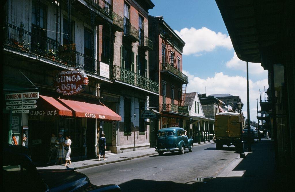 A view down Bourbon street and the Gunga Den in New Orleans, 1957.