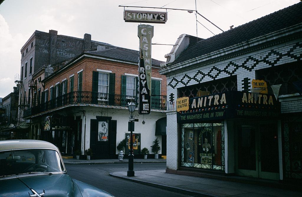 A view down Bourbon street and the Naughtiest girls in Town Club and Casino Royale in New Orleans, Louisiana in May 16, 1957.