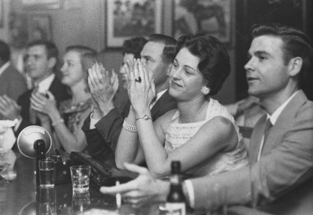 Patrons listening to music at the Paddock Lounge jazz cafe on Bourbon Street, New Orleans, Louisiana, 1950