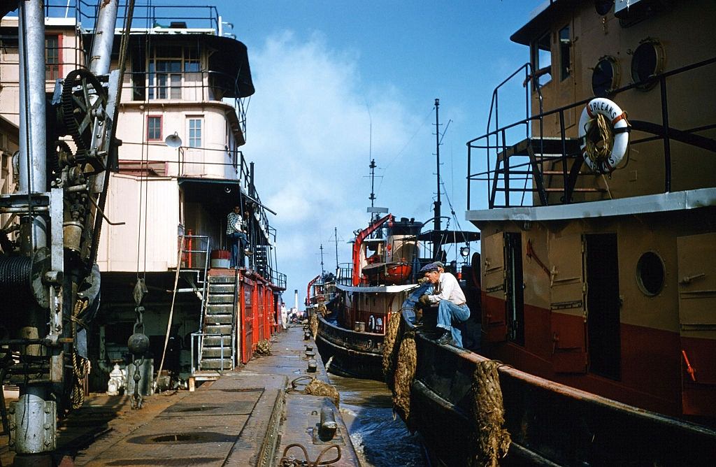 The tugboat "Orleans" moves into port in New Orleans, 1957.