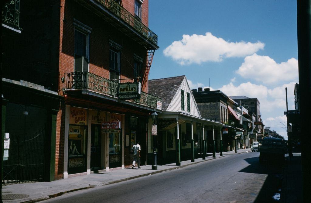 A view down Bourbon street outside Mardi Gras lounge in New Orleans, 1957.