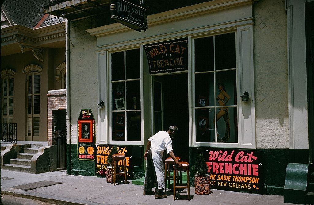 A view down Bourbon street outside Wild Cat Frenchie Bar in New Orleans, 1957.