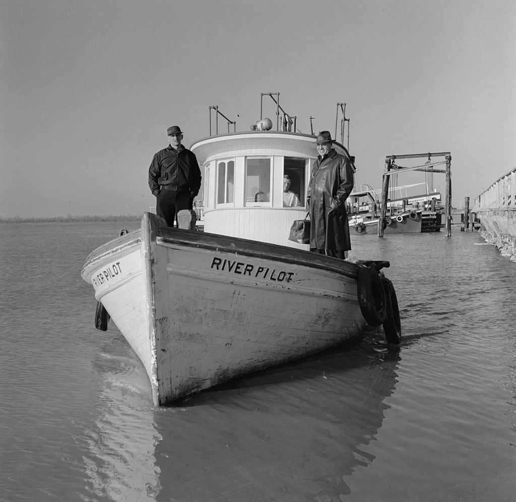 A small river boat taking a river pilot from Pilottown, 1955