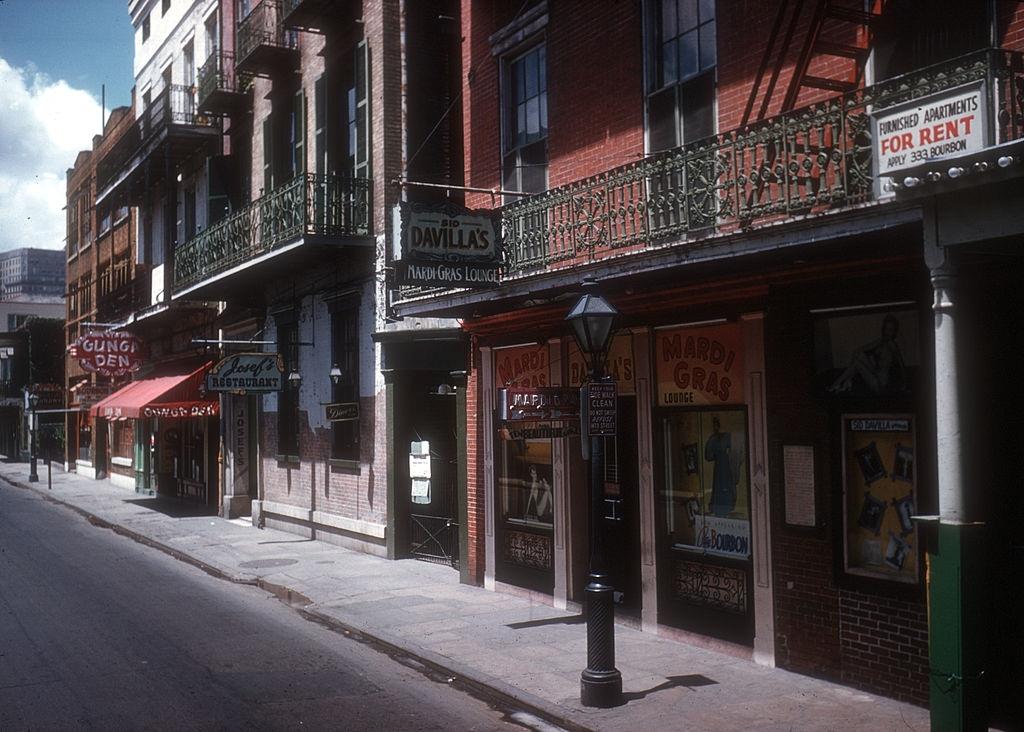 Exterior of 'The Mardi Gras Lounge' and 'Gunga Den' On Bourbon Street on May 16, 1957 in New Orleans, Louisiana.