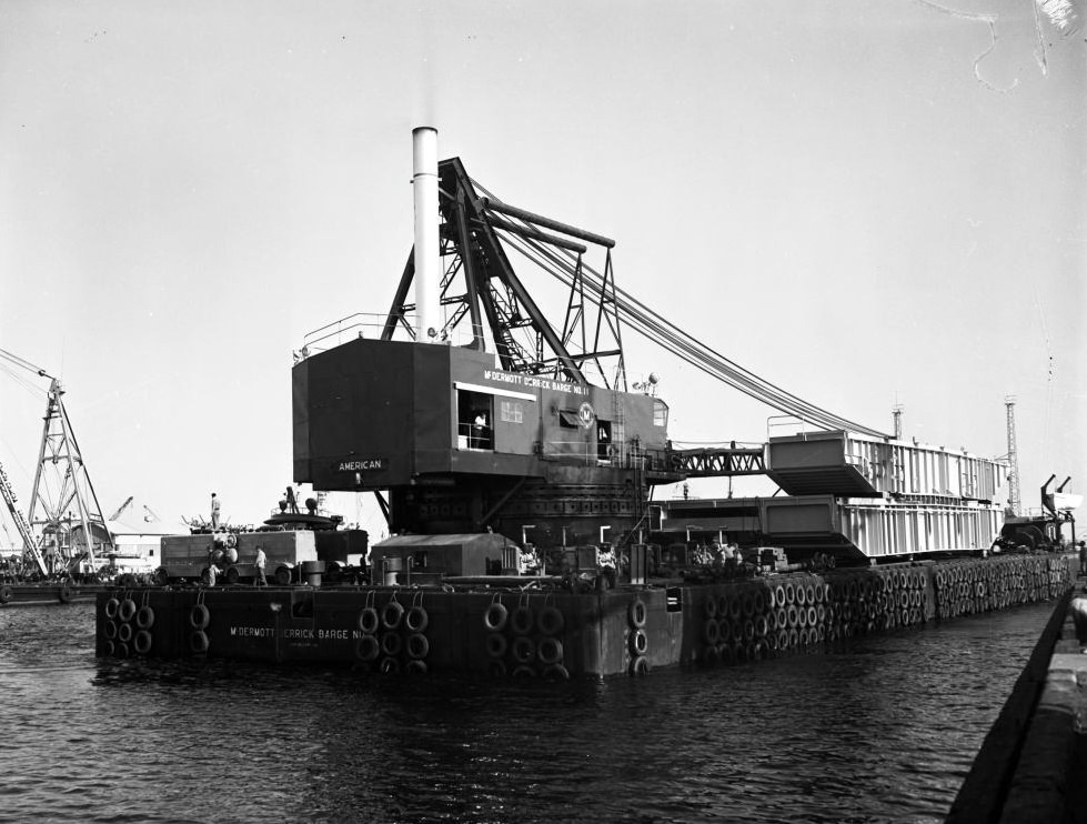 Barge entering Long Beach Harbor to pick up eighty-five feet, 1958