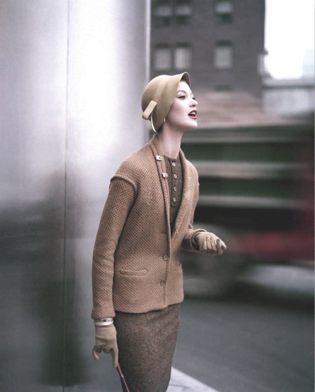 Barbara Mullen wearing mustard and black wool topped by gold knit sweater by Loomtogs, felt hat by Betmar, gloves by Fownes, twin lapel clips by Coro, August 1953