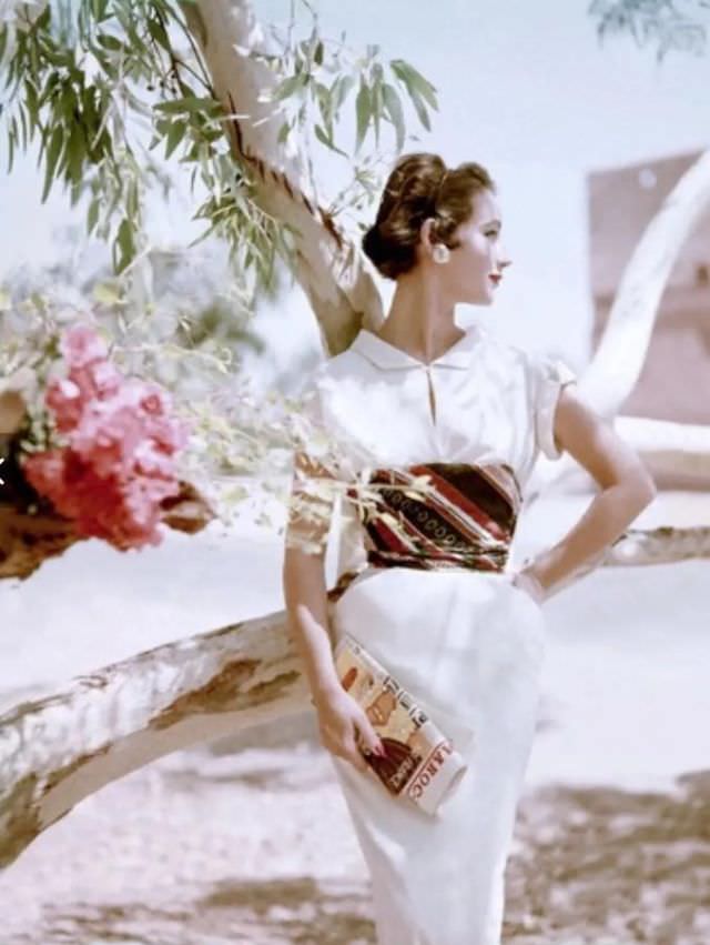 Model wearing a dress of cotton challis, wrapped waist by Samuel Winston, 1953