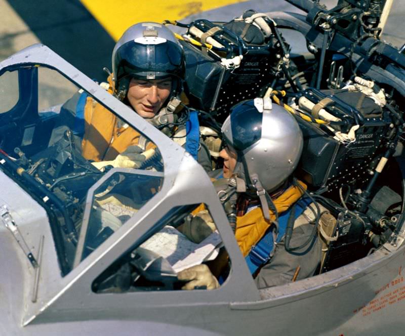 Flying Instructor Flight Lieutenant J Davis with his student, Flight Cadet TC Porteous of No. 76 Entry, in a De Havilland Vampire T11 at the RAF College Cranwell, Lincolnshire, 1959