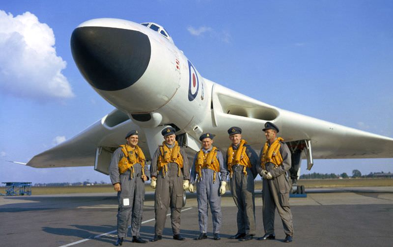 The crew of an Avro Vulcan B.1 bomber pose in front of their aircraft, 1956