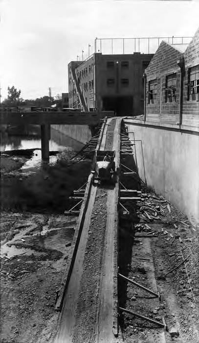 Truck going down ramp from Villita Street to construction site of San Antonio River cutoff channel, San Antonio, 1929