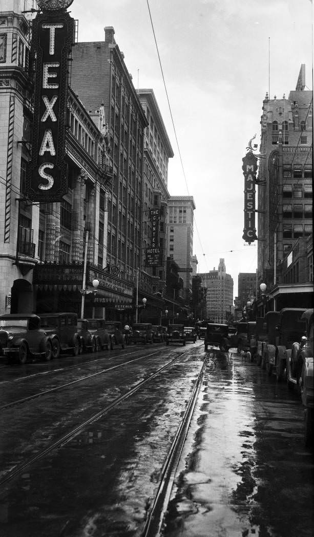 Houston Street looking east from San Antonio River bridge following rain shower, San Antonio, 1929