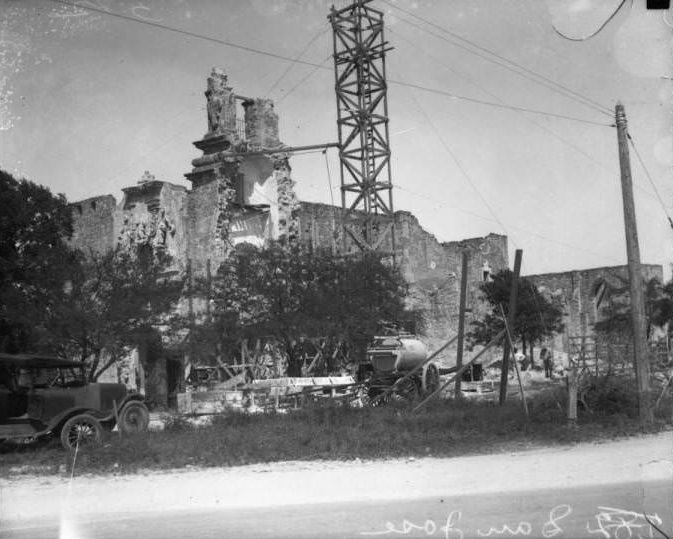 Exterior view of San Jose y San Miguel de Aguayo Mission during the restoration of the tower, 1928