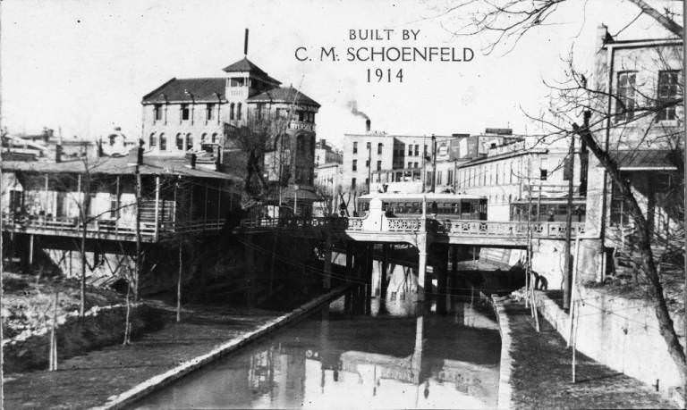 A view of the Commerce Street Bridge from the Market Street Bridge over the San Antonio River, 1920s