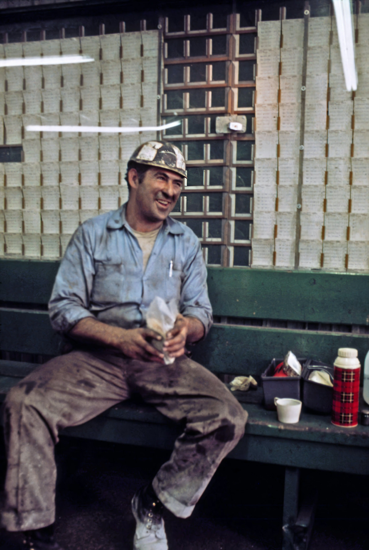 A miner spreads his lunch out on a bench in the shower and time card room of the Virginia-Pocahontas Coal Company mine #3 near Richlands, Virginia.
