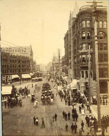 Looking north on 1st Ave. from James St. showing July 4th parade, Seattle, 1890