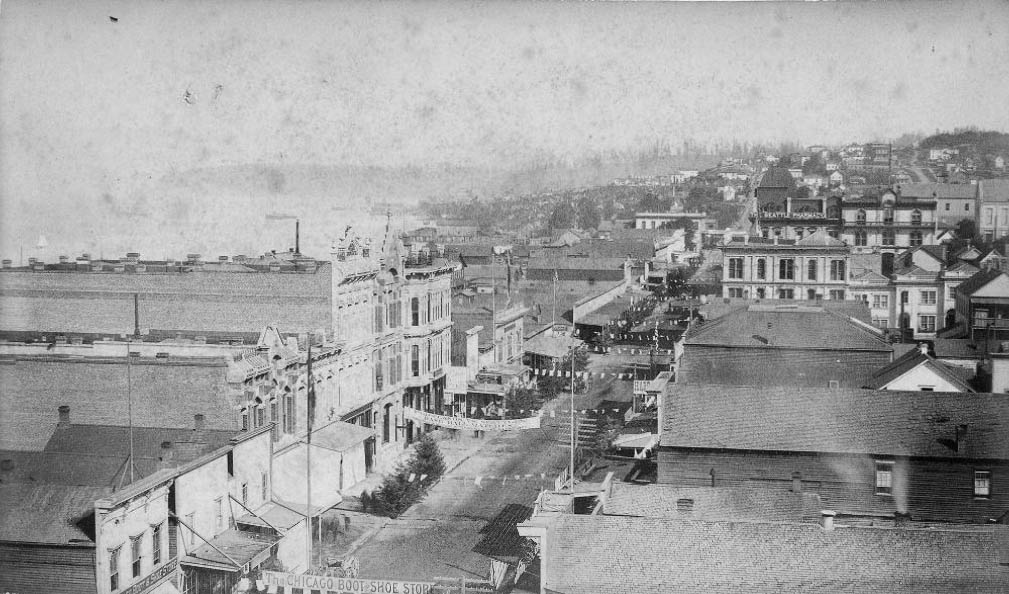 Front St. (1st Ave.) looking north from Yesler Way, 1884