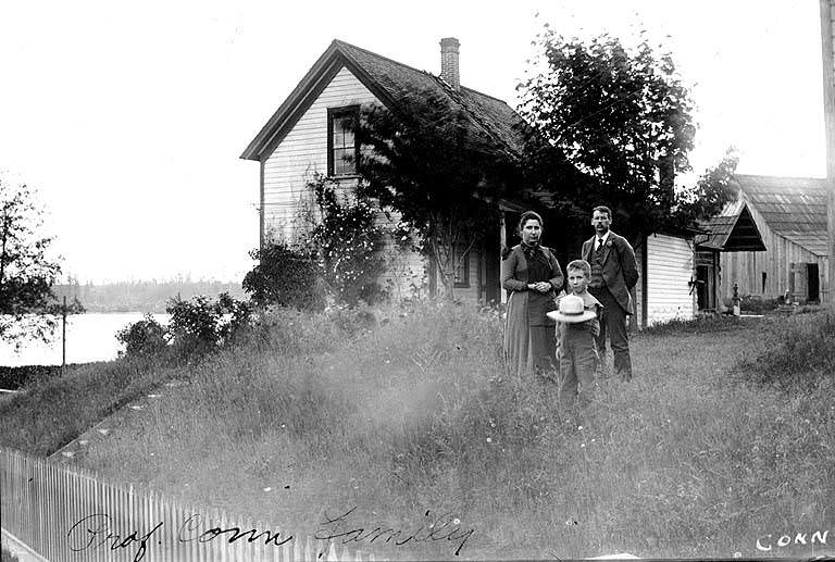 George Conn, wife, and son Neil standing outside Judge William D. Wood house, 1897
